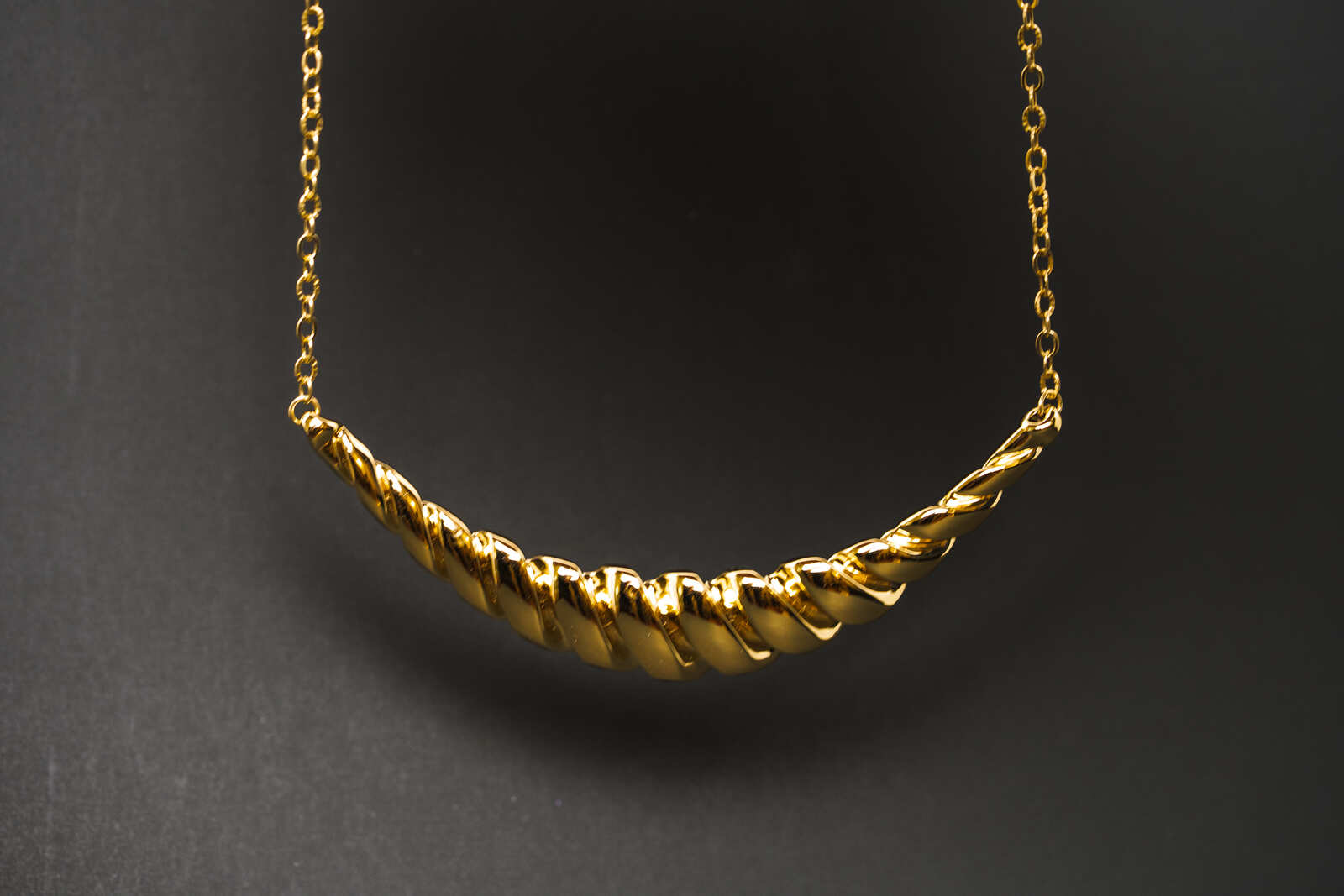 Twisted necklace dark background