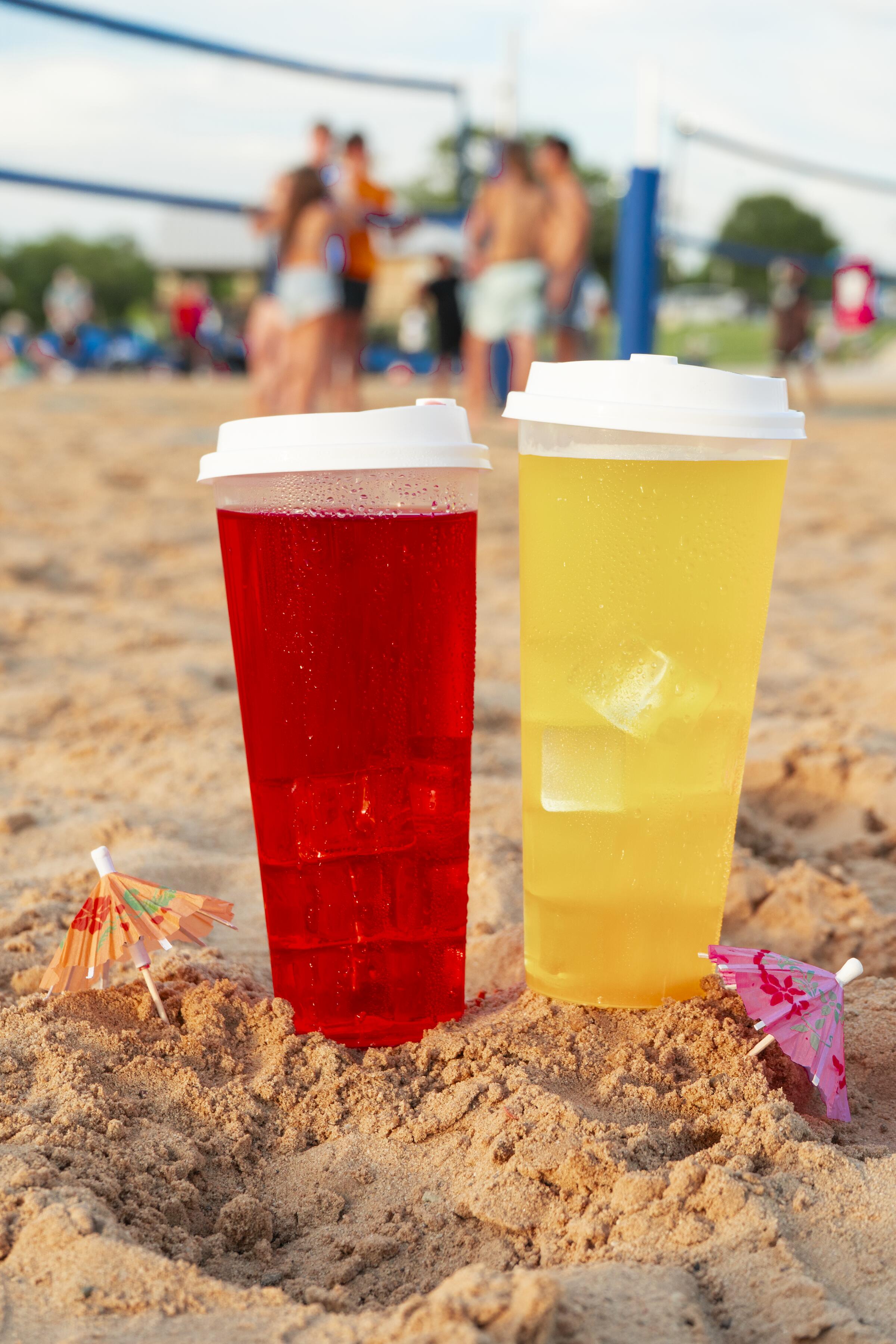 Two cups in sand