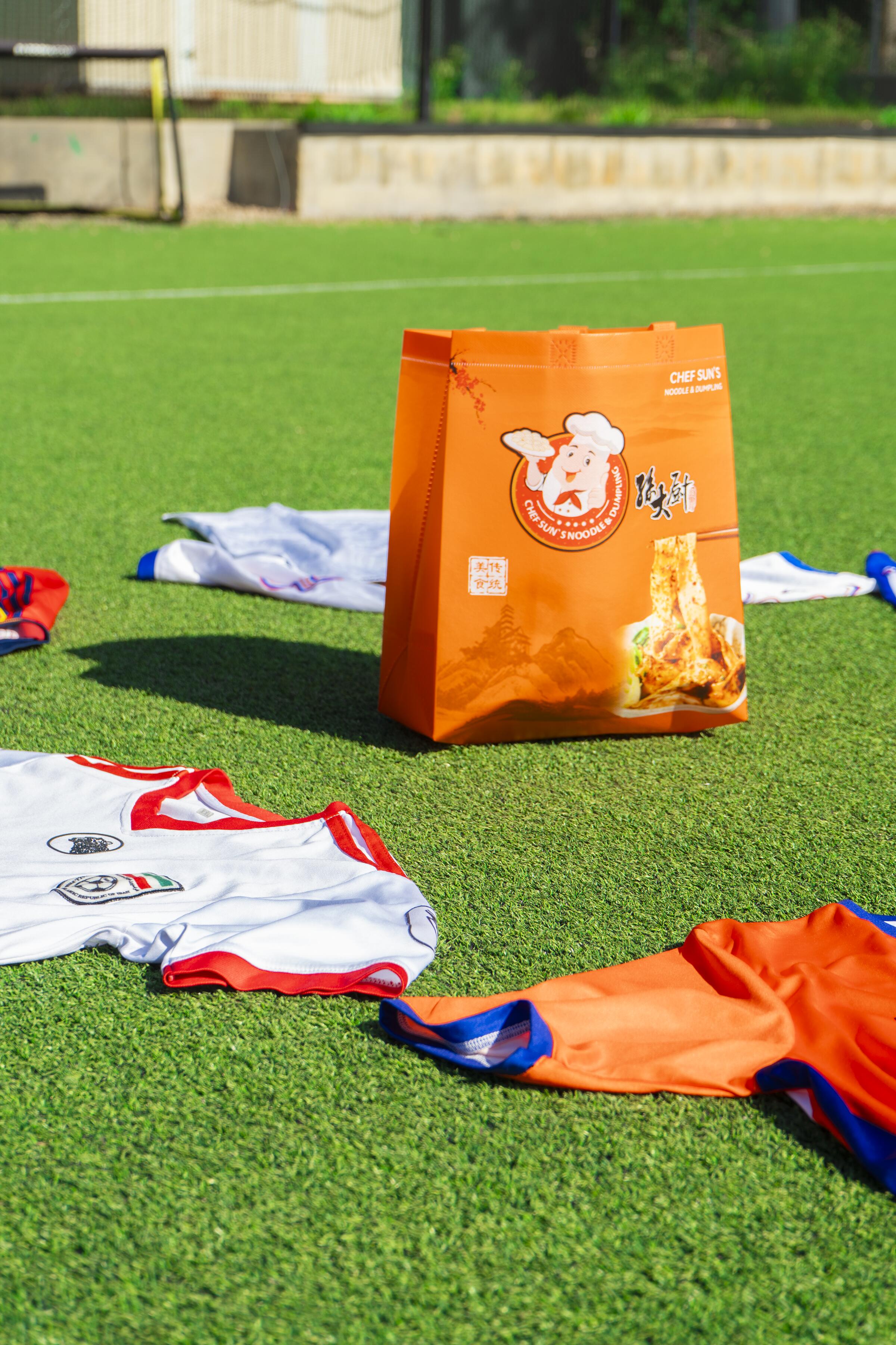 Bag on turf with jerseys